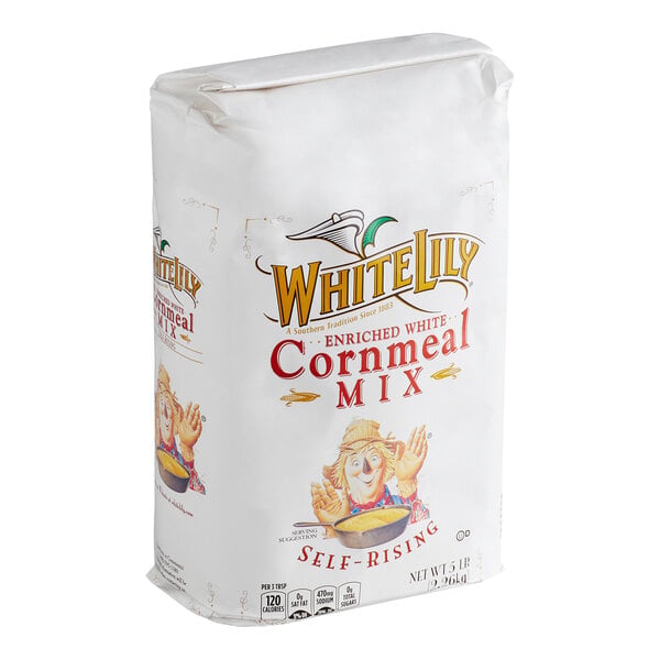 A white paper bag labeled 'White Lily Enriched White Cornmeal Mix Self-Rising' with an illustration of a woman holding a bowl.