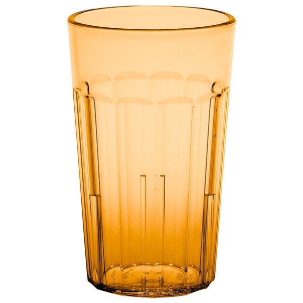 A close up of an amber Cambro plastic tumbler.