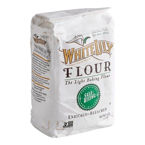 A 5-pound bag of White Lily self-rising flour with enriched and bleached labeling, featuring a white package with gold and green accents.