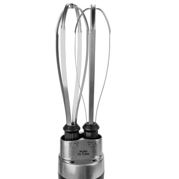 A close-up of a Waring metal whisk attachment with two metal blades.