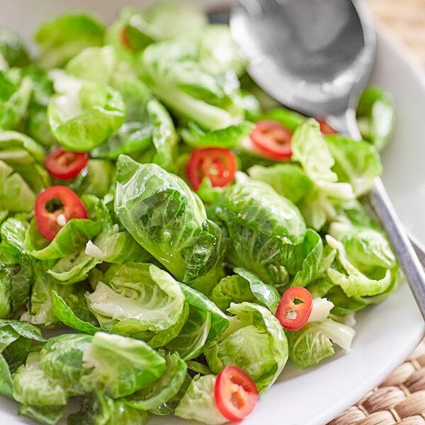 A plate of brussels sprouts with Lee Kum Kee Sichuan Peppercorn Flavored Oil.