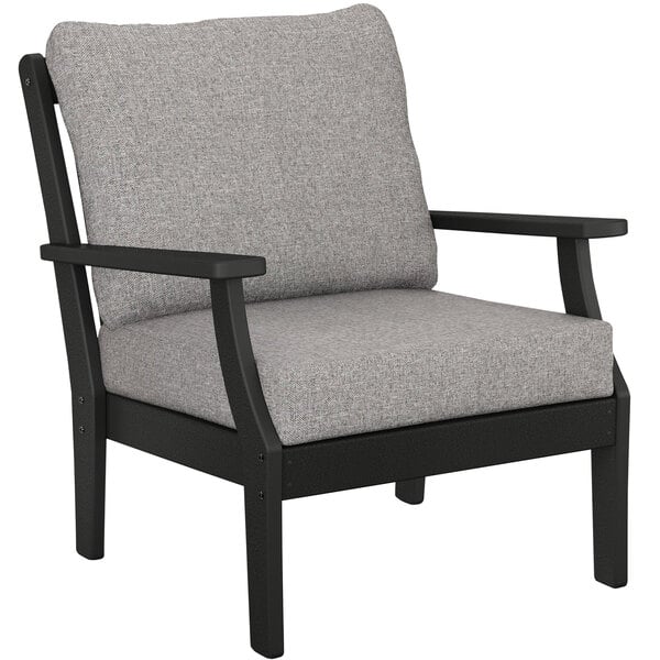 A grey and black POLYWOOD outdoor arm chair with a grey cushion.