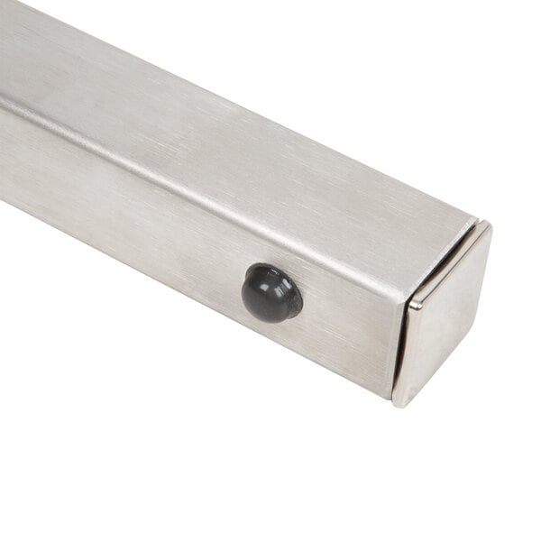 A metal bar with a black round object on each end.