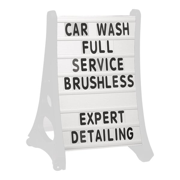 A white Aarco curved letterboard sign with black text that says "Car Wash Full Service Brushless Detailing Expert"