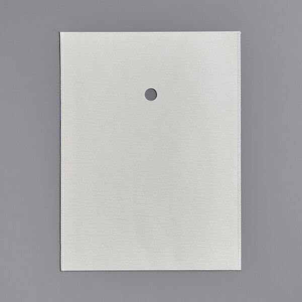 A white paper with a hole in it.