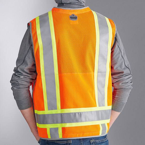 A man wearing an orange Ergodyne heavy-duty reflective safety vest.