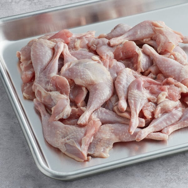 A tray of Manchester Farms partially boned quail legs.