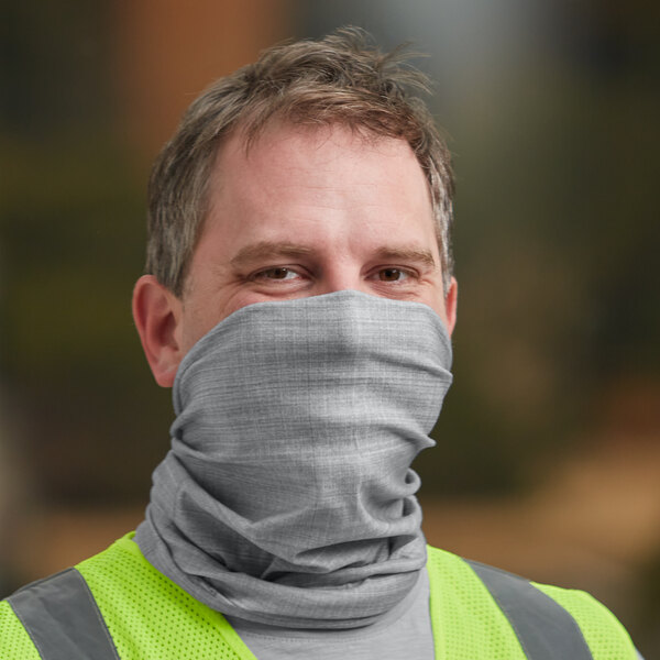 A man wearing a gray Ergodyne Chill-Its multi-band covering over his face.