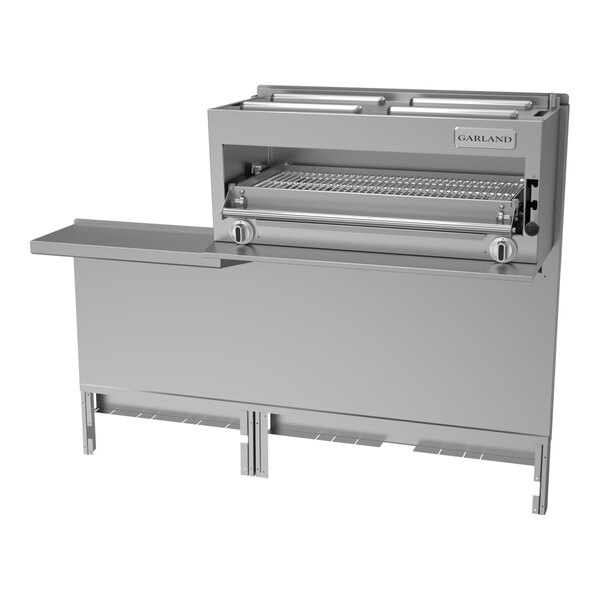 A large stainless steel Garland salamander broiler grill with a shelf and a drawer.