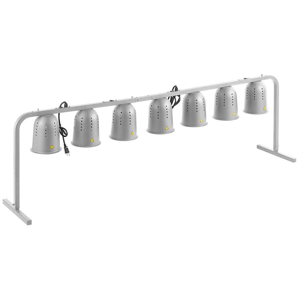 A white metal rack with seven silver heat lamps.