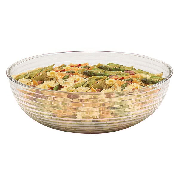 A clear Cambro Camwear round ribbed bowl filled with pasta and asparagus.