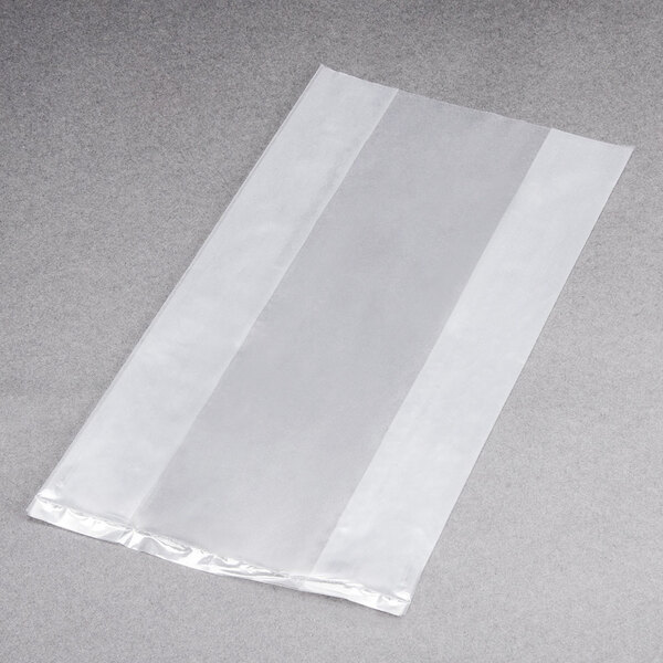 A clear plastic LK Packaging food bag on a grey surface.