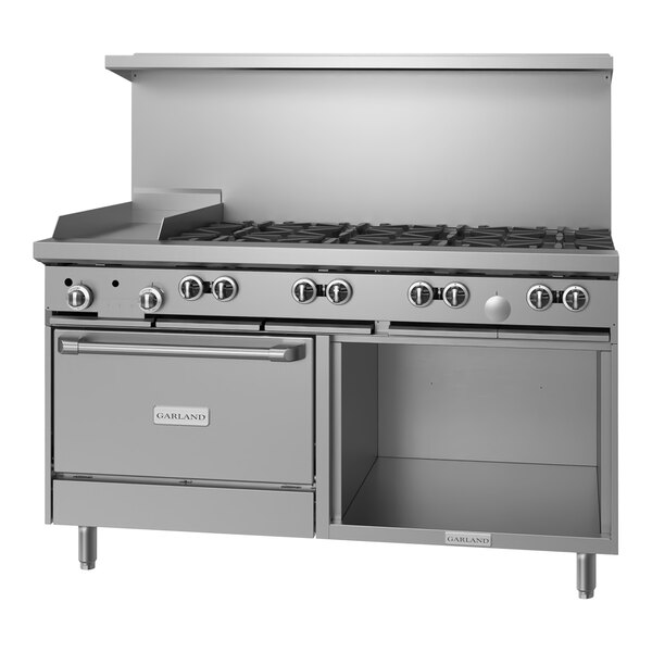 A large stainless steel Garland range with 8 burners, a griddle, and storage.