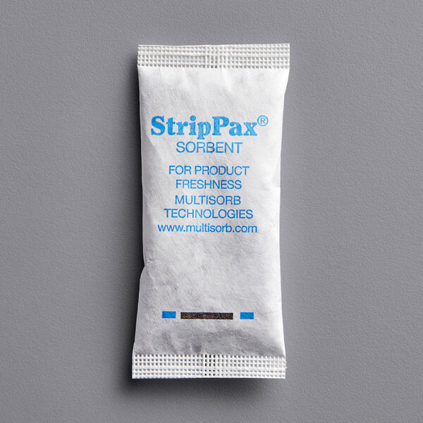 A close-up of a white Multisorb StripPax desiccant packet with blue text.