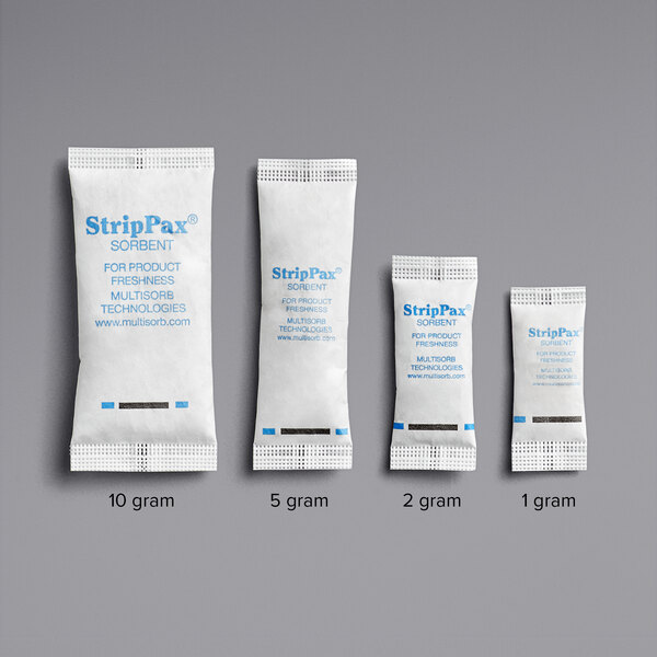 A group of small white Multisorb StripPax packets with blue text.