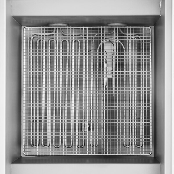 An electric deep fryer with a metal mesh basket and heating elements, designed for commercial use.