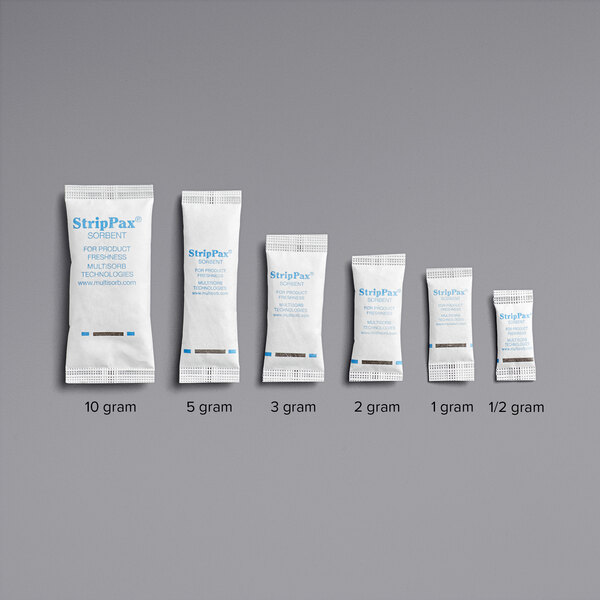 A row of small white Multisorb Silica packets with blue text.