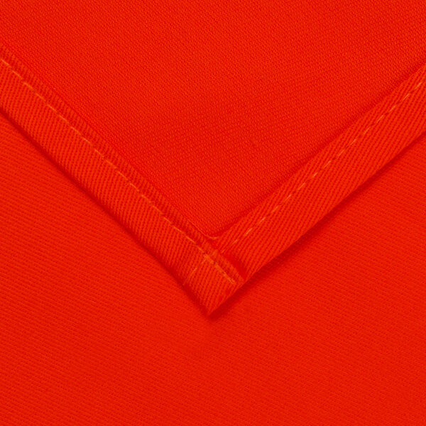 A close up of an orange fabric with a white lining.