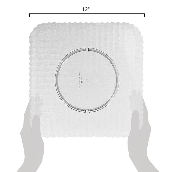 A person holding a clear square polycarbonate plate with a circle on it.