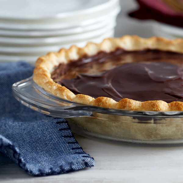 A chocolate pie in an Anchor Hocking deep dish glass pie pan.