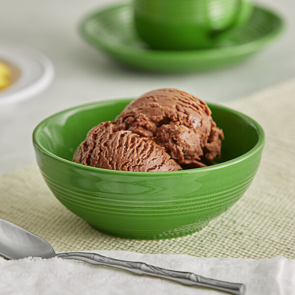 A palm green Acopa Capri stoneware bowl filled with chocolate ice cream.