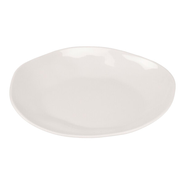 An ivory melamine plate with a slightly irregular round shape.