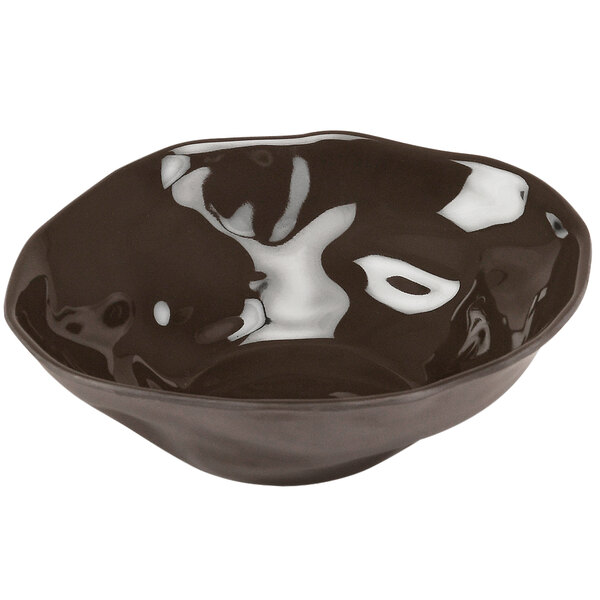 A brown Cal-Mil melamine bowl with a white rim.