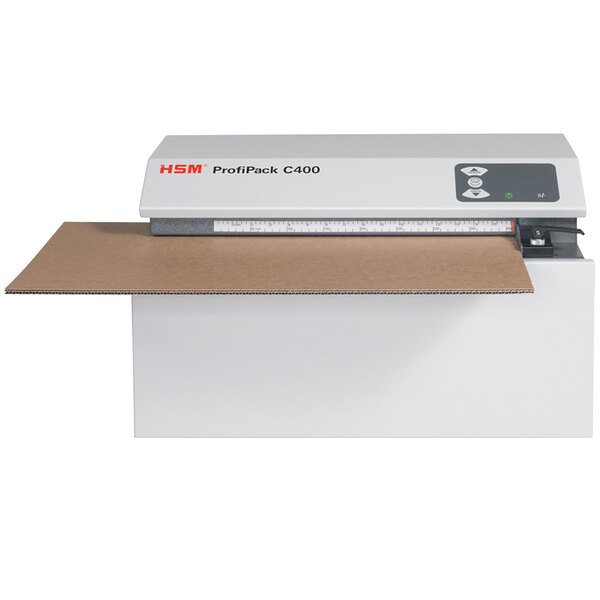 A white rectangular object with black and brown text reading "HSM HSM1528 / C400 ProfiPack 1 Layer"