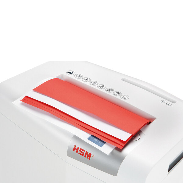A white paper being shredded in a HSM ShredStar X6pro shredder.