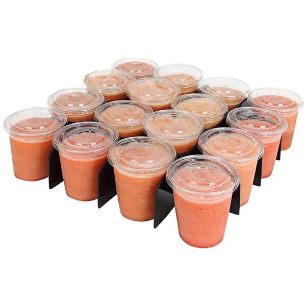 A Sterno School Nutrition Parfait Divider with plastic cups of fruit juice in it.
