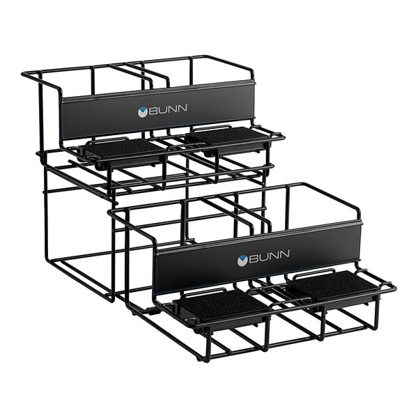 A black metal Bunn universal airpot rack with two tiers and four trays on it.