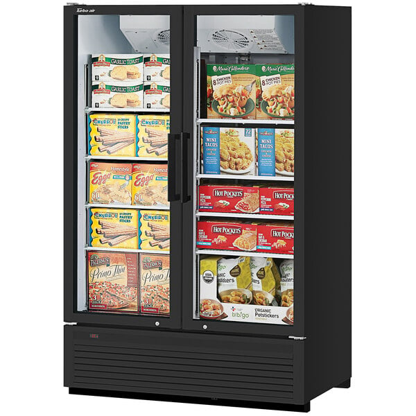 A black Turbo Air Super Deluxe glass door freezer with frozen food inside.