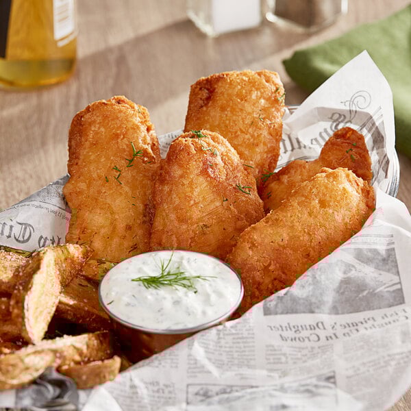 A basket of Mrs. Friday's Tavern Battered Cod Fillet portions with fries.