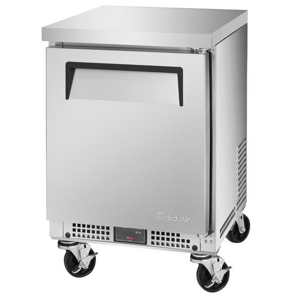 A silver Turbo Air undercounter refrigerator with a solid door.