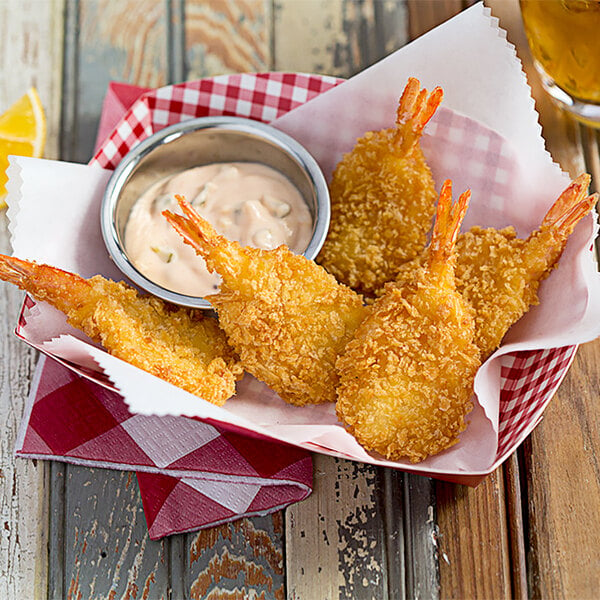 Breaded extra colossal shrimp served with a sauce
