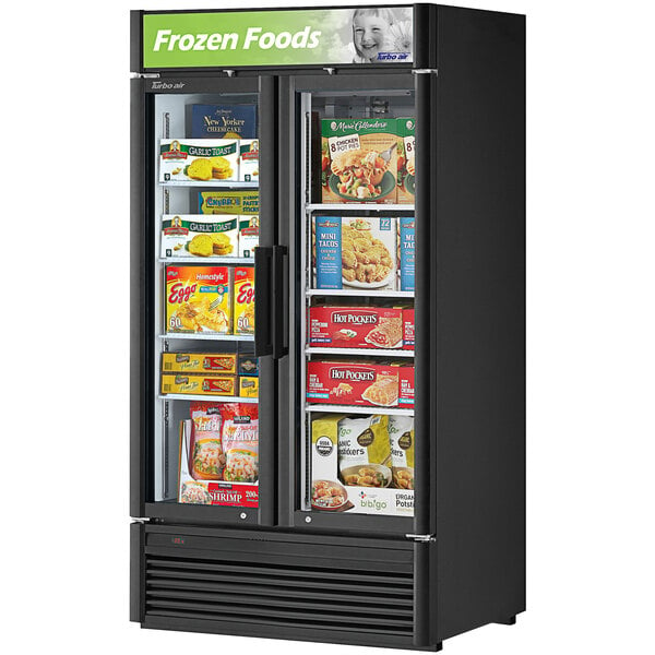 A Turbo Air black swing 2 door freezer with frozen food inside.