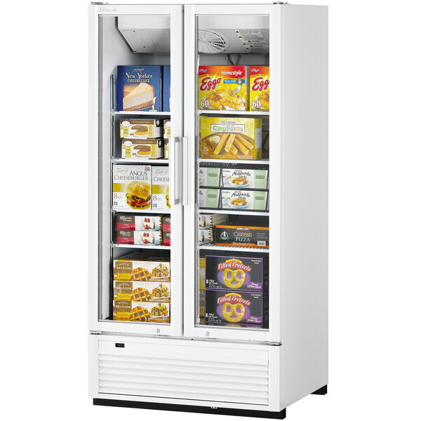 A white Turbo Air Super Deluxe swing door freezer with a door open.