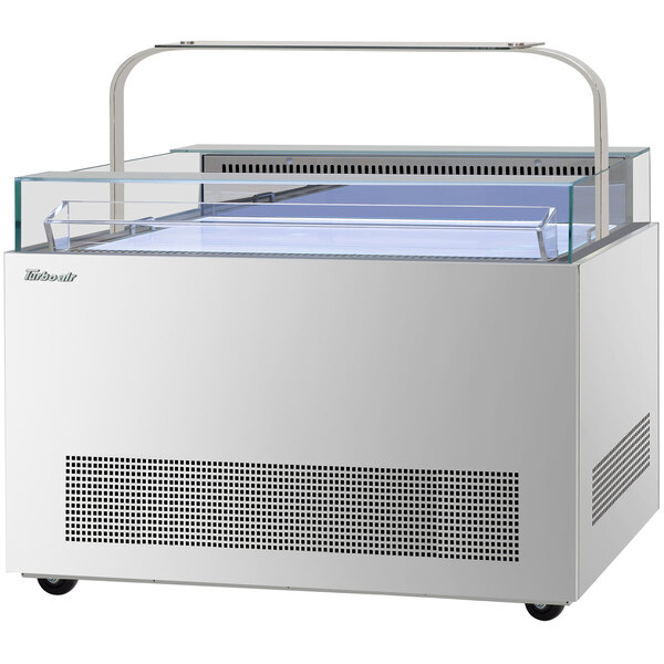 A white Turbo Air sandwich and cheese display case with glass doors on top and front.