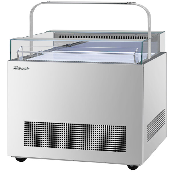 A white rectangular refrigerator with a glass top.