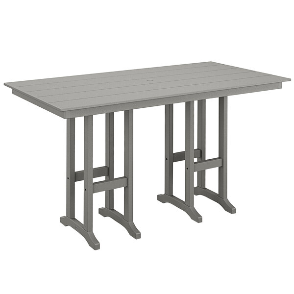 A POLYWOOD slate grey bar height table on an outdoor patio.