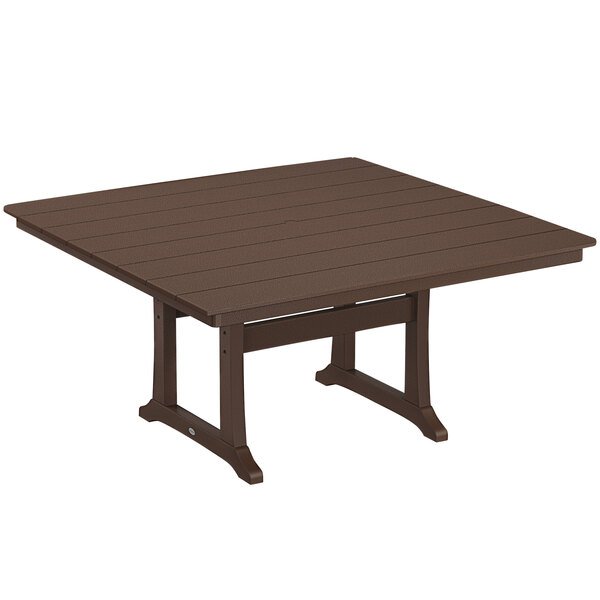 A brown POLYWOOD table with wooden trestle legs.