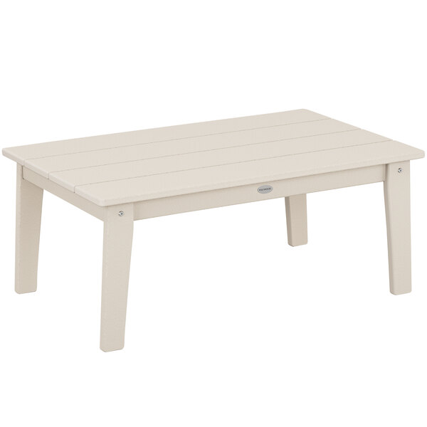 A sand POLYWOOD Lakeside coffee table with white legs.