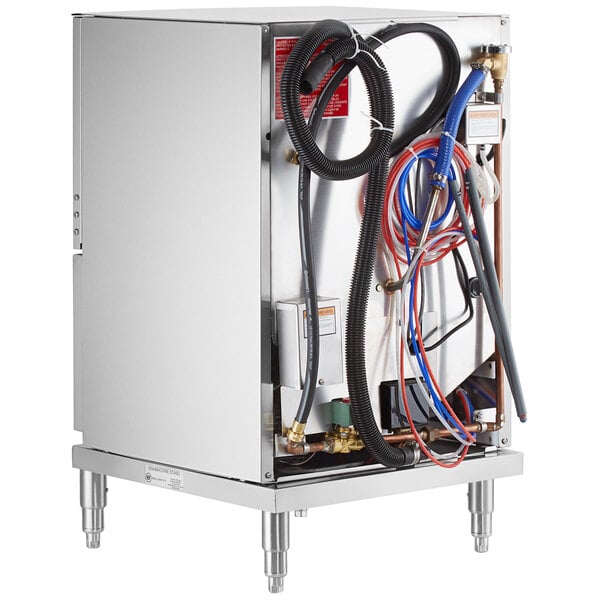 A Noble Warewashing undercounter dishwasher with pipes and hoses.