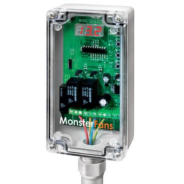 A close-up of a Schwank MonsterFans control module with a green circuit board and white text on a black box.