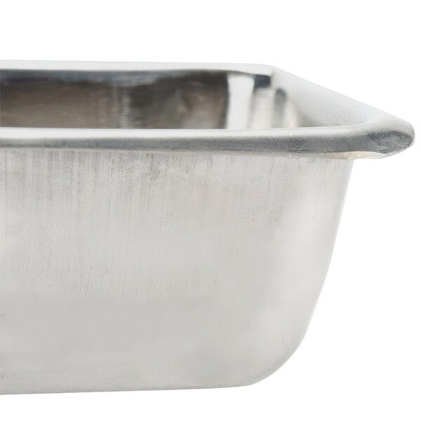 An American Metalcraft stainless steel square sauce cup on a counter.