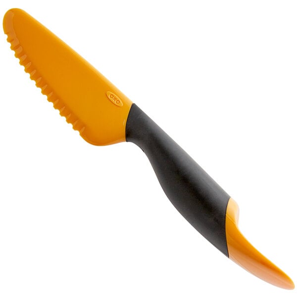 An OXO Good Grips mango slicer with an orange handle and blade.
