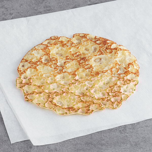 A White Toque vanilla fluffy crepe on a white napkin.