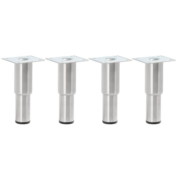 Three stainless steel legs with a silver cylindrical object.