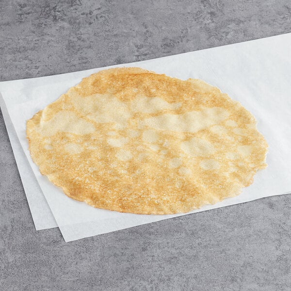 A White Toque crepe on a white surface.