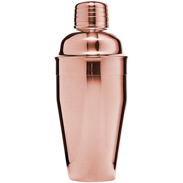 A close-up of a Franmara copper cobbler cocktail shaker with a metal lid.